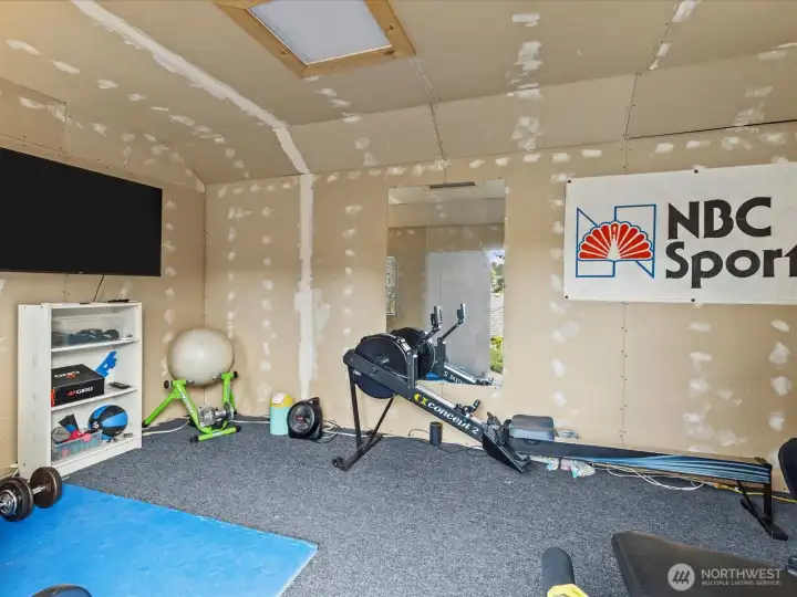 Large storage shed that can be used as a workout room shown here or an office or just storage. Additional storage space in the attic.