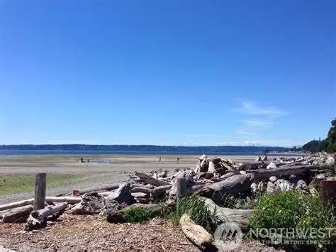 Normandy Park Club House - Lot A Members Club house, located at the Cove. The Cove (a.k.a. Lot A) consist of 18 acres located at the west end of SW Shorebrook Drive in the city of Normandy Park, WA. It includes 700 feet of waterfront on Puget Sound, a community clubhouse, tennis courts, woods with interpretive trails, two creeks (Miller and Walker), a duck pond for salmon rearing and a wetland area. The Cove is privately owned by 1800 households which have an equal and undivided interest in this property. Use of the Cove property is limited to Lot A owners and their guests