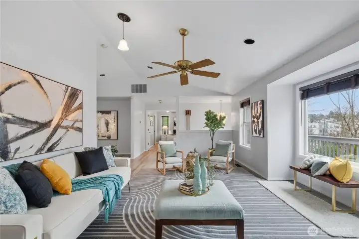 Open concept design flows seamlessly between living and dining areas.