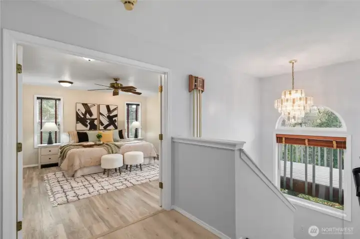 Double doors lead into the spacious primary suite.