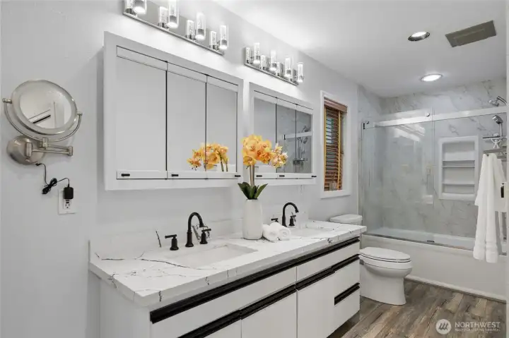 The main bathroom features dual sinks, providing ample space and enhancing morning routines.