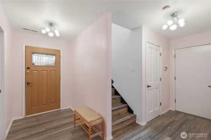 Welcoming entry with updated flooring and second bedroom/ bathroom access.