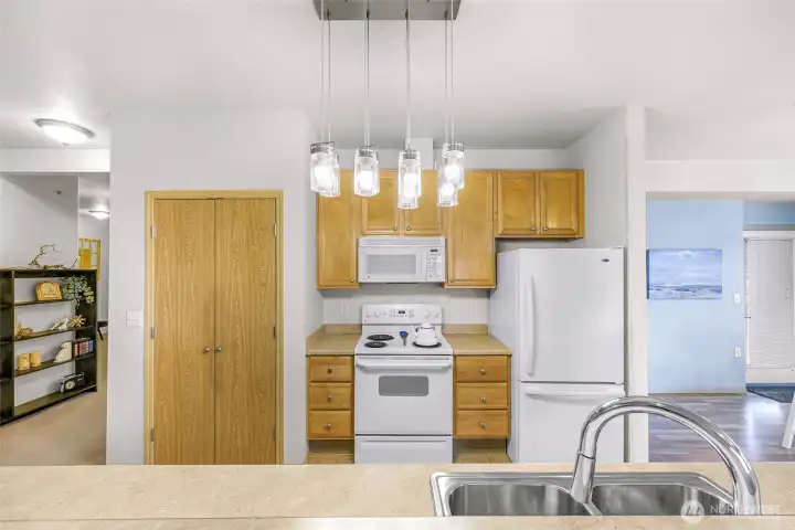 There is a walk-in pantry on the left of the stove.
