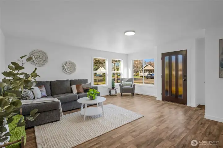 Come on in and relax in this spacious living room with tons of natural light!