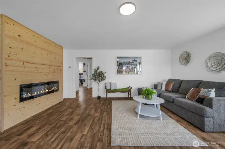 Amazing custom electric fireplace in the living room along with new floors, paint and trim as well!