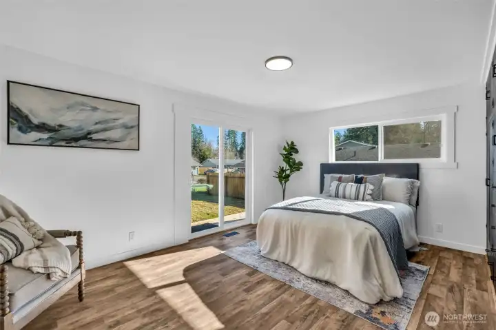 Primary bedroom with a slider to the backyard