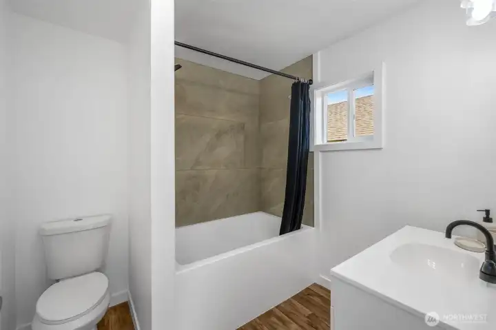 Enjoy the extra deep tub surrounded by massive tiles!