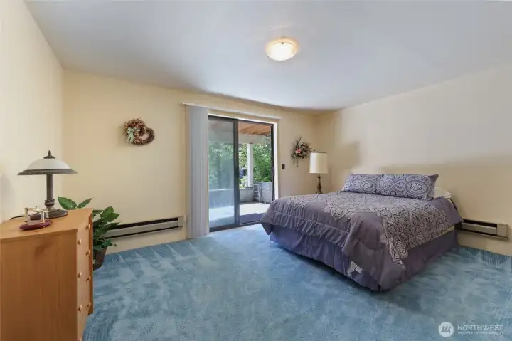 Large Bedroom with Slider out to the covered patio