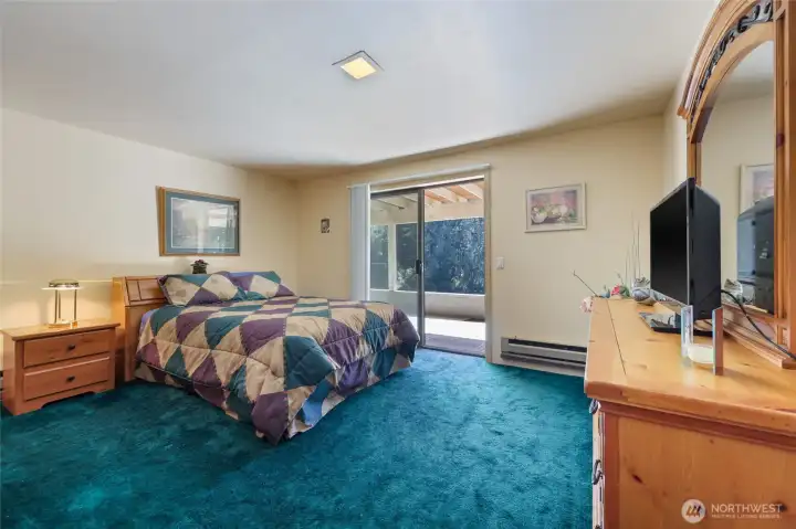Bedroom with a slider to the covered patio