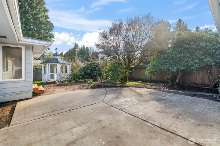 Large patio and ample backyard space for entertaining and gardening.