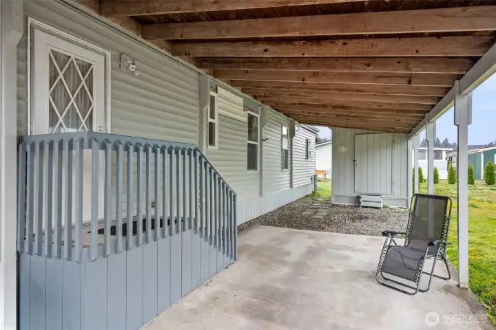 Carport with storage shed