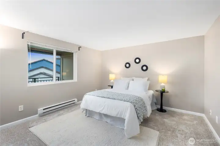 Spacious Primary Suite with plush new carpet and natural light.