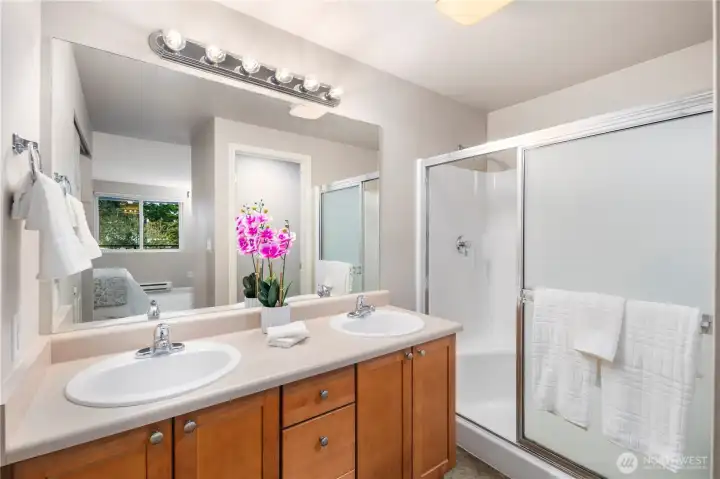 Dual sinks in the primary suite ensuite and full shower