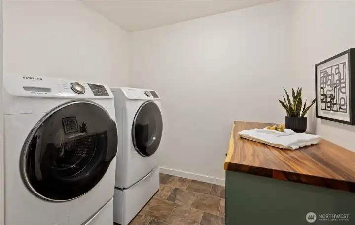 Large laundry room on 2nd floor providing easy access to bedrooms.