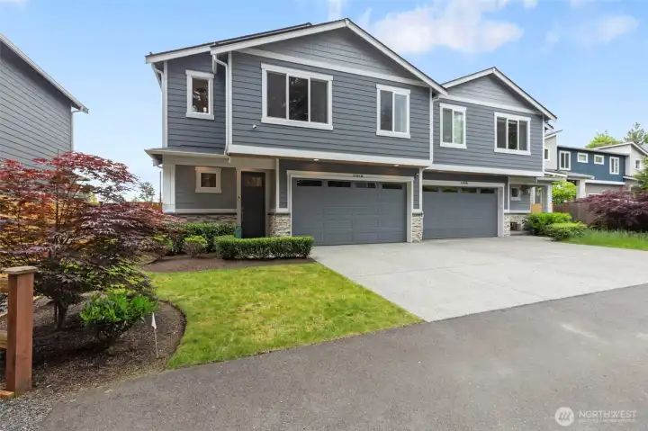 Built in 2023, this modern townhouse lives like a single-family home with fully fenced backyard