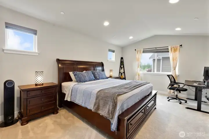 Large primary suite with abundant daylight and room for a king size bed.