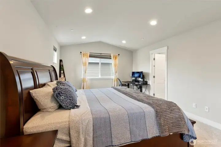 Primary suite with door on the far right leading to the goreous bathroom.