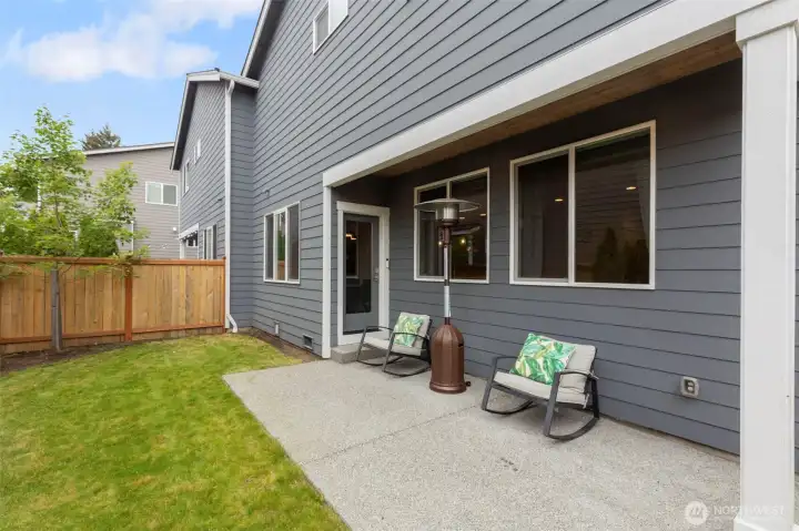 Covered back patio and fully fenced backyard for year-round enjoyment.