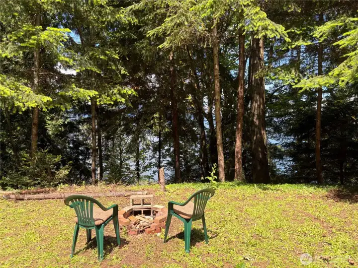 Relax by the fire as you take in the west-facing water views of Dabob Bay.