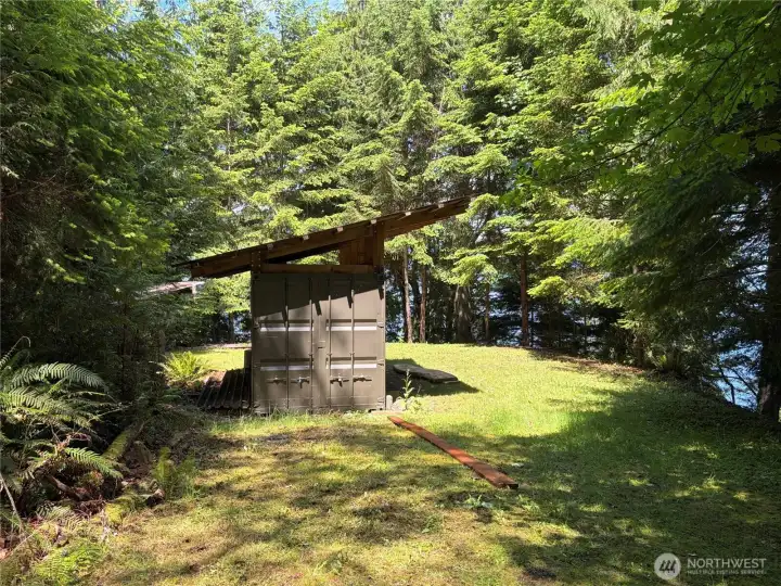 Small parking area next to cabin.