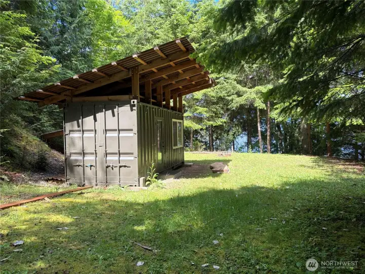 The shipping container has been loving modify into a comfortable dry cabin.