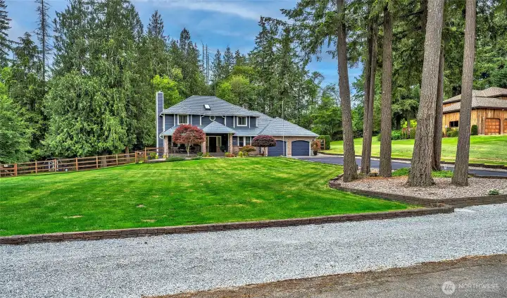 Plenty of guest parking, mature landscaping and a freshly sealed driveway.