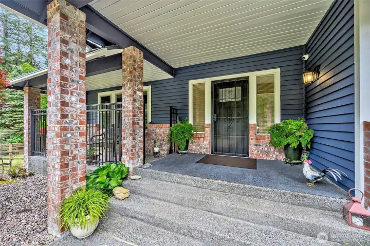 Inviting entry with a covered gated front porch.