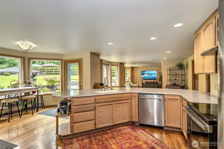 Kitchen leads to the great room and has a door to the impressive back yard and patio.