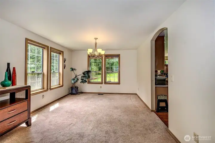 Formal dining room , notice the wood wrapped windows throught.