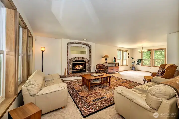 Living room offers a brick wood burning fire place.