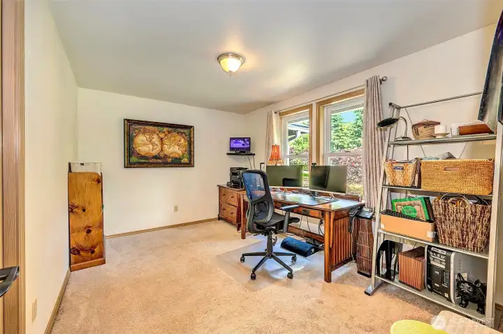 Main level bedroom currently used as a home office.
