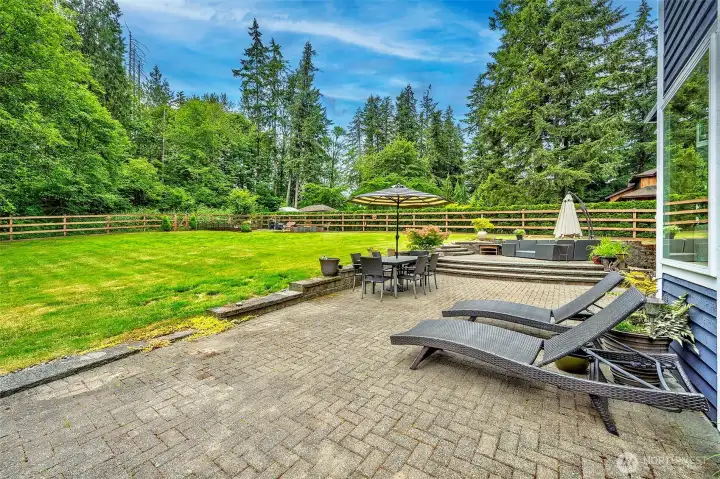 Afternoon sun on the patio with the fully fenced, southern exposer back yard