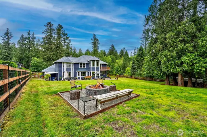 Back yard fire pit and sitting area.