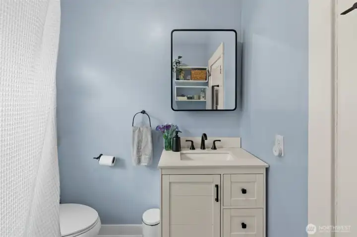 Bathroom is located between the two main floor bedrooms.