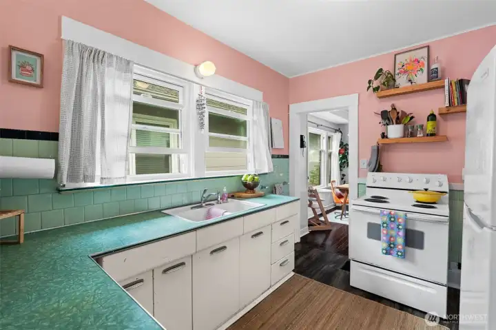 Love the vintage green countertops and metal cabinets.
