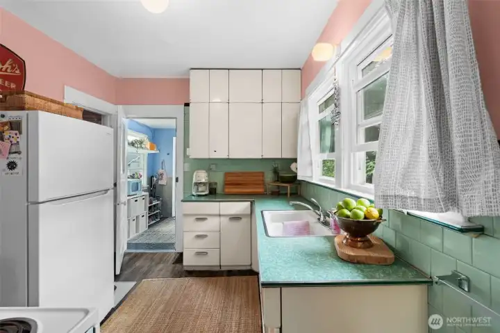 The pantry is on this side of the fridge.