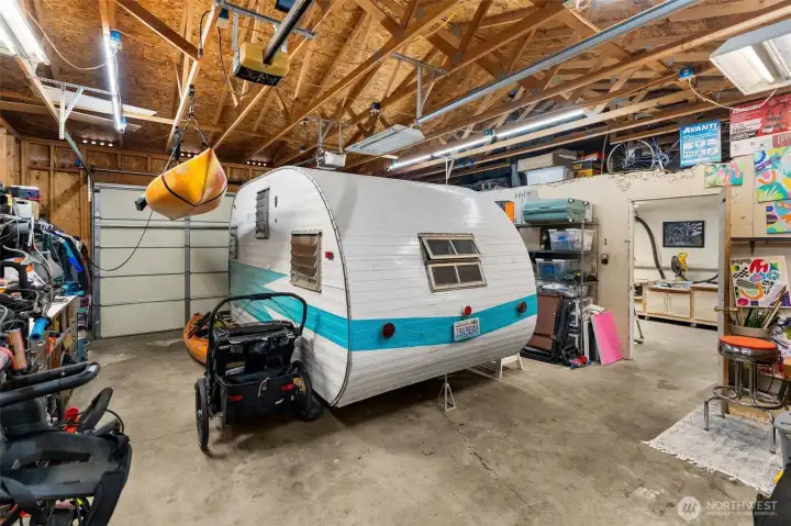 The 2 car garage has its own 90amp electric panel and a walk through to the shop.