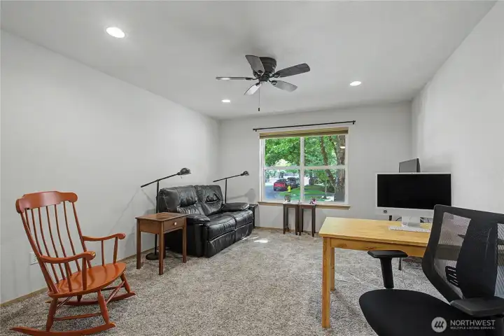 This is the second bedroom which is at the front of the home, they us it now for their office/family room. This is the second bedroom which is at the front of the home, they us it now for their office/family room.