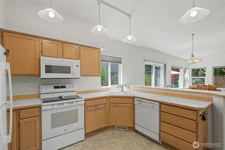 Another view of the kitchen that looks into the living room. Love all of the windows!! Another view of the kitchen that looks into the living room. Love all of the windows!!