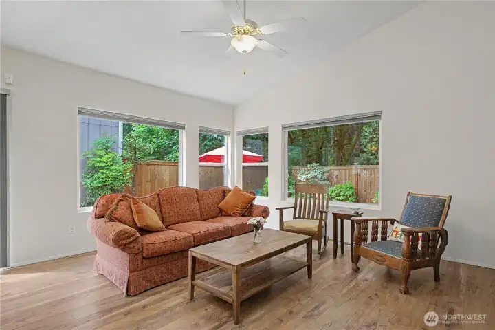 Living room has so many window that bring in so much natural light. Living room has so many window that bring in so much natural light.