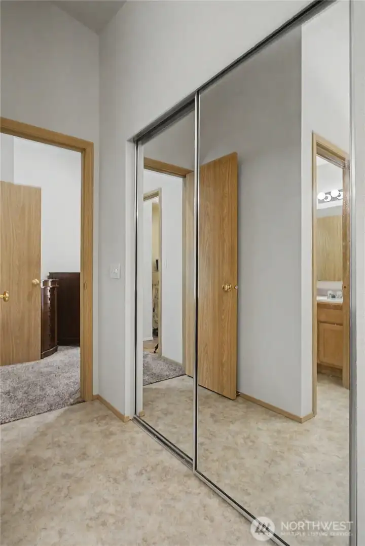 Primary bedroom walk-in closet Primary bedroom walk-in closet