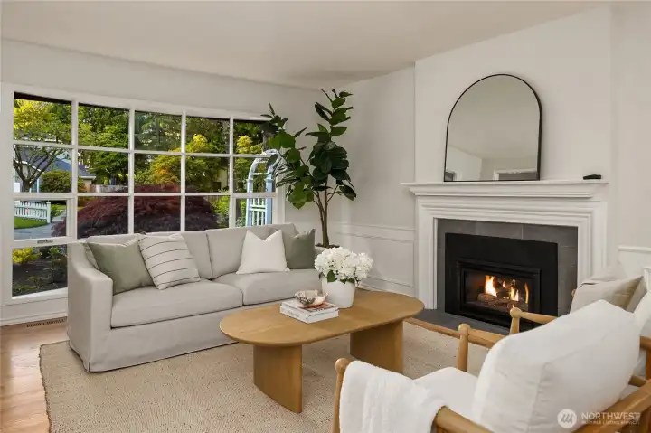 The elegant living room with its newly painted surfaces, bay windows and east coast fireplace surround details make it a standout first impression.