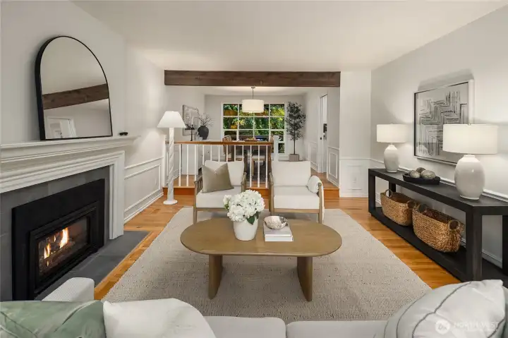 Bathed in natural light and framed by beautiful architectural details, this sophisticated yet comfortable living room is perfectly suited for both relaxed everyday living and gracious entertaining. It also flows seamlessly into the dining area.