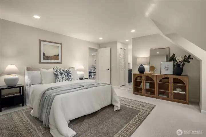 Light, bright, and big primary bedroom. All new lighting throughout (with dimmers, of course) make this room ambient any time of day - a true sanctuary.