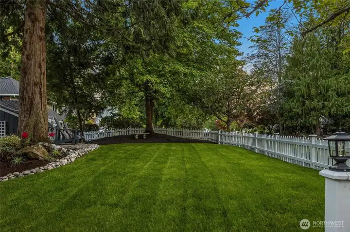 Fresh sod, nutrient-rich mulch, and a thoughtful mix of mature and newly refreshed landscaping frame the home’s classic exterior, offering a beautifully low-maintenance front yard with timeless appeal. Every outdoor space has been refreshed and designed to enjoy.