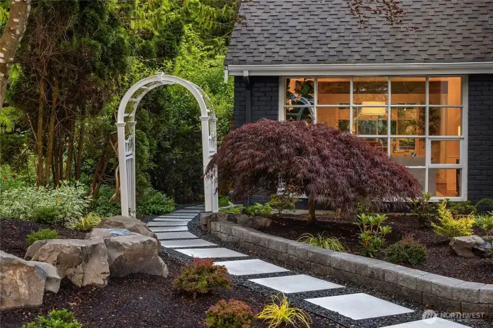 The home's classic exterior, blending new and mature surrounding landscaping, and generous yard space combine to create an idyllic and low-maintenance outdoor living environment.