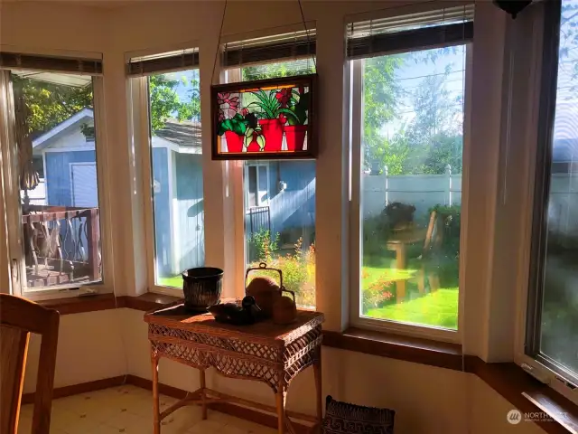 Bay Window Looking Out From Dining Table to Backyard