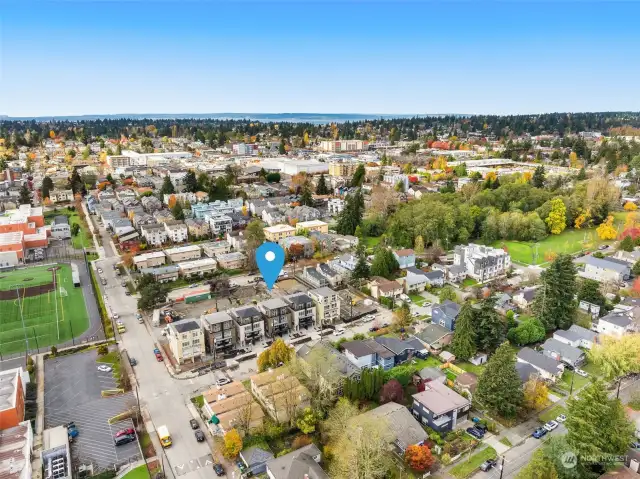 An expansive view shows the neighborhood surrounding Clover, highlighting its proximity to schools and recreational areas.