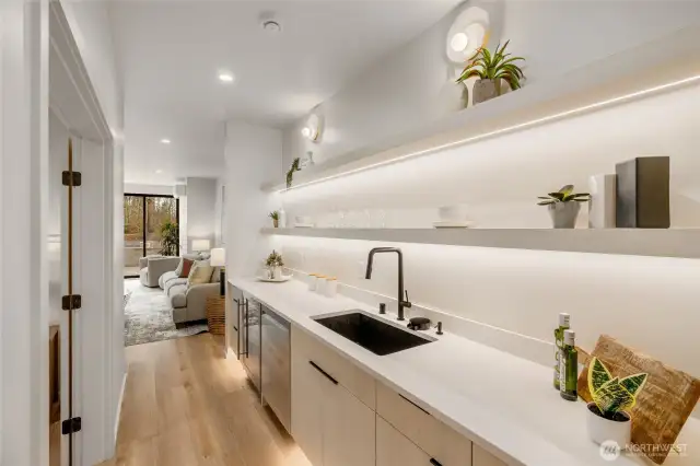 Lower Level Retreat: A versatile lower level includes a bedroom, 3/4 bath, patio, and wet bar, perfect for guests or casual entertaining.