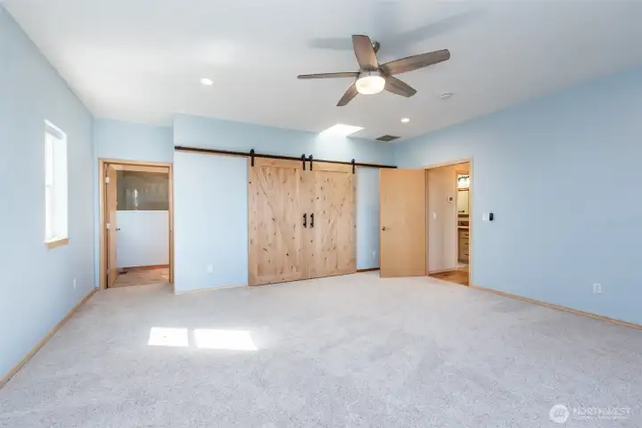 Primary closet with barn doors.